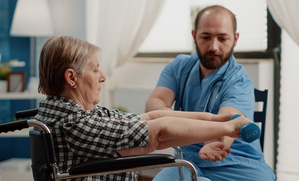 Senior Carer helping Aged Woman